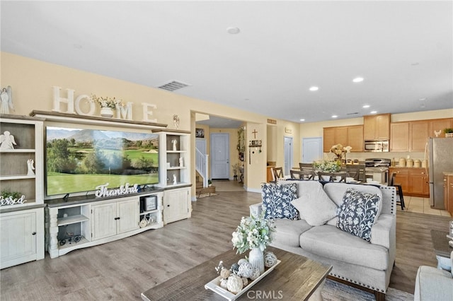 living room with light hardwood / wood-style flooring