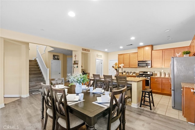 dining room with light wood-type flooring