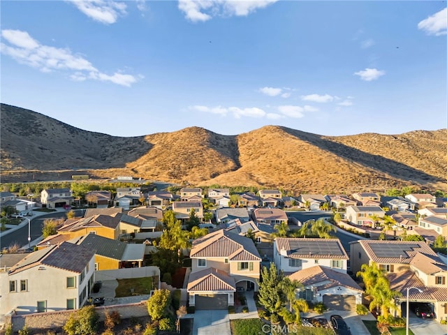 birds eye view of property featuring a mountain view