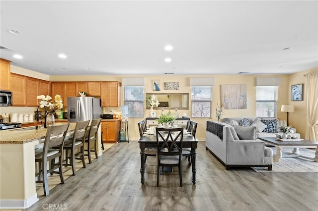 dining room with light hardwood / wood-style flooring