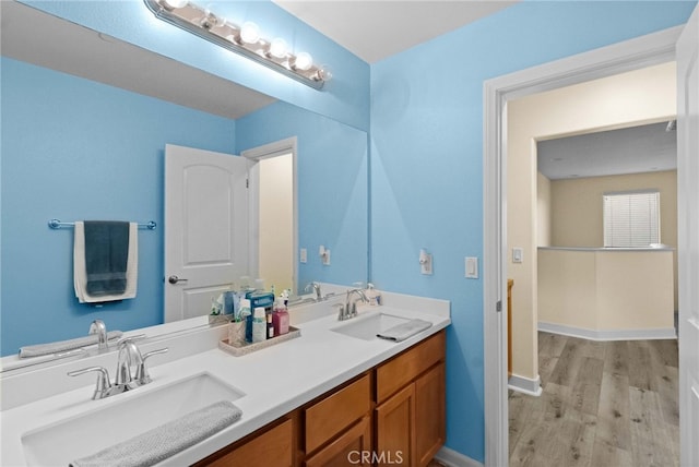 bathroom with vanity and hardwood / wood-style floors