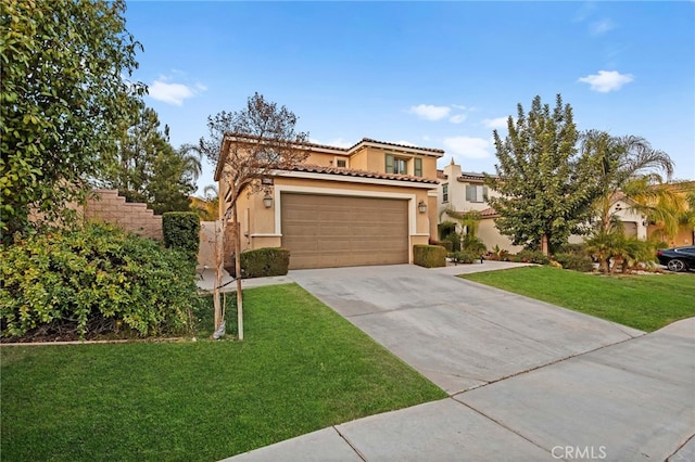 mediterranean / spanish-style house featuring a front lawn and a garage