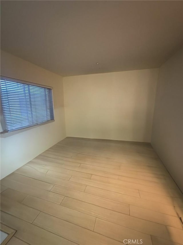 unfurnished room featuring light hardwood / wood-style flooring