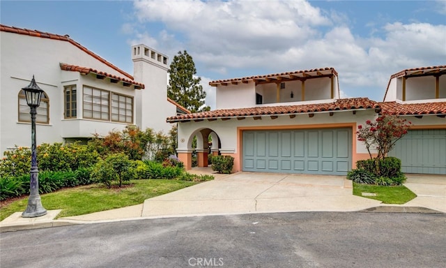 mediterranean / spanish-style house featuring a garage