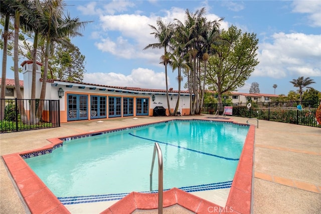 view of swimming pool featuring a patio area