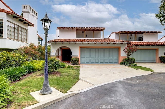 mediterranean / spanish-style house featuring a garage