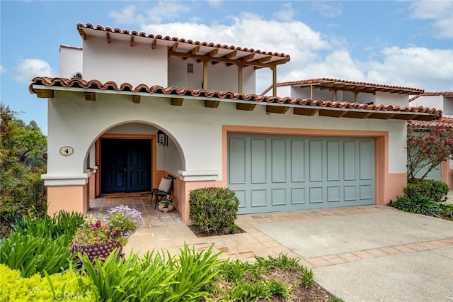 mediterranean / spanish-style house featuring a garage