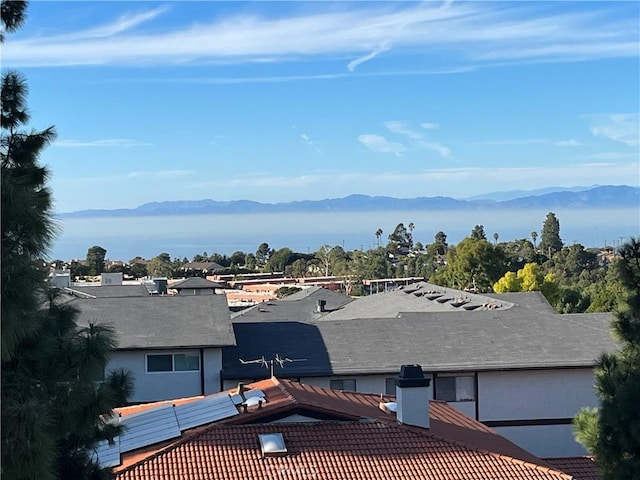 birds eye view of property with a mountain view