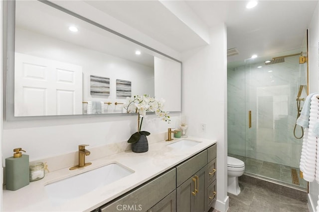 bathroom with vanity, an enclosed shower, and toilet