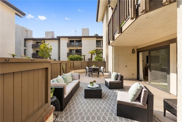 view of patio / terrace featuring an outdoor living space and a balcony