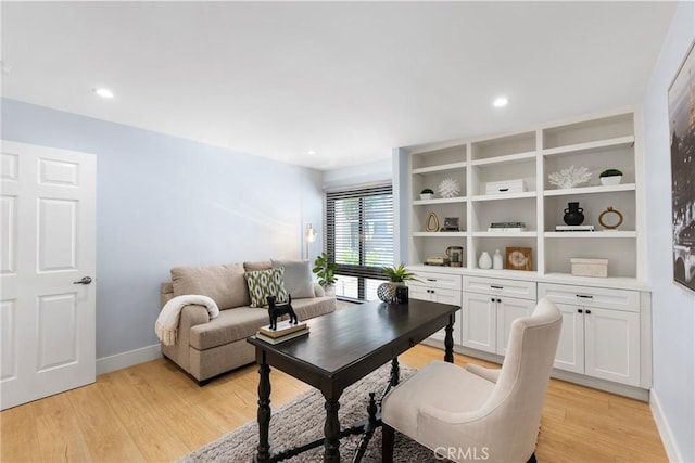 office space with light hardwood / wood-style flooring