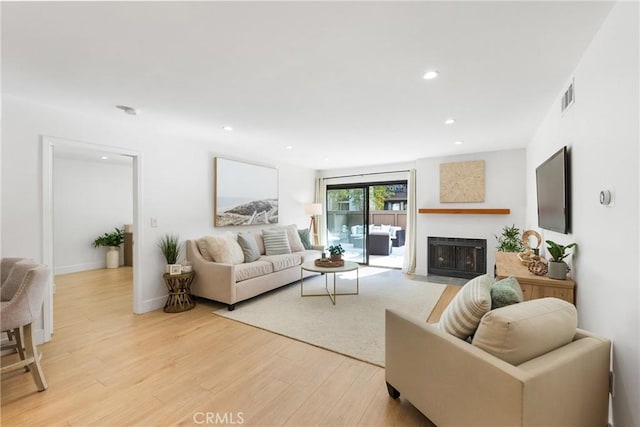 living room with light hardwood / wood-style floors