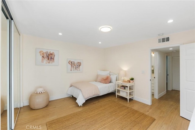 bedroom with hardwood / wood-style floors