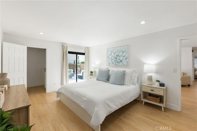 bedroom with access to outside and light hardwood / wood-style floors