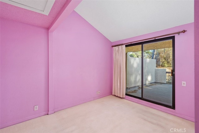 spare room with light colored carpet and lofted ceiling