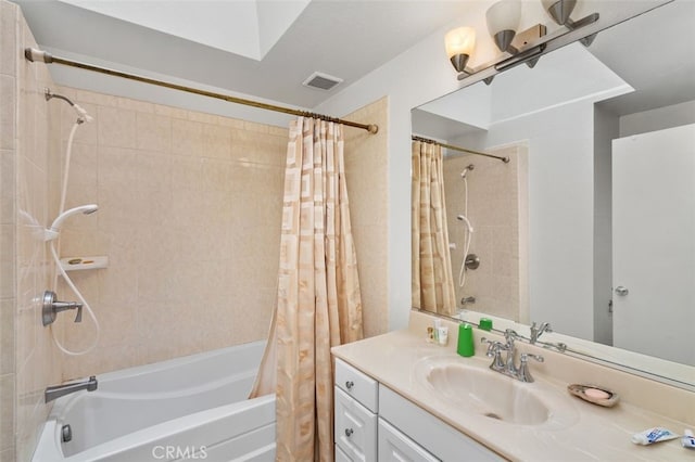 bathroom with vanity and shower / bath combo with shower curtain