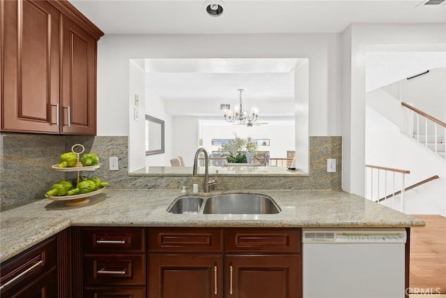 1824 S Marengo Ave Unit 27, Alhambra, CA 91803 - kitchen featuring dishwasher, a sink, light stone countertops, and a chandelier