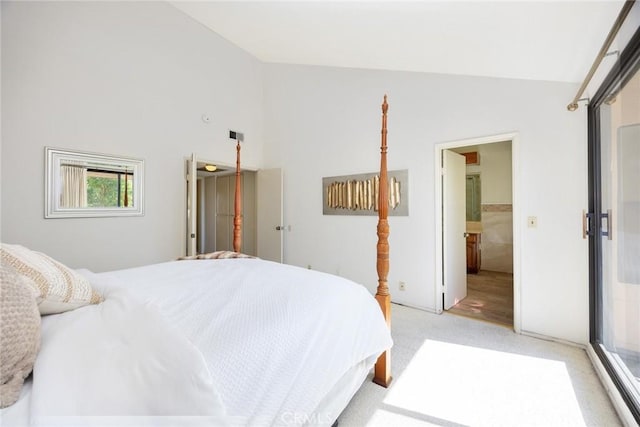 1824 S Marengo Ave Unit 27, Alhambra, CA 91803 - bedroom with light colored carpet, high vaulted ceiling, and ensuite bath
