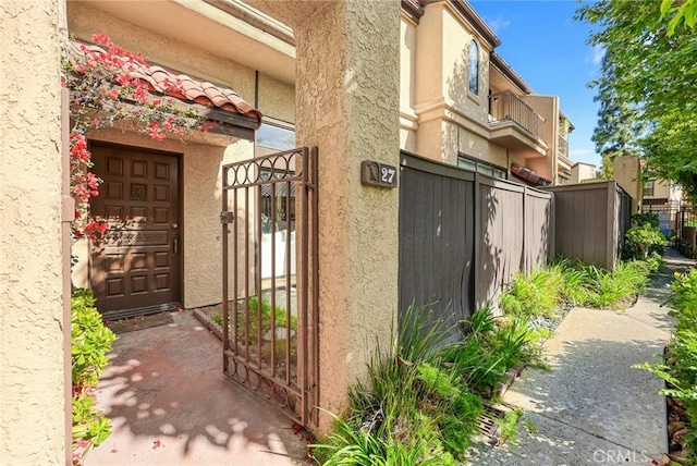 1824 S Marengo Ave Unit 27, Alhambra, CA 91803 - entrance to property with a gate, fence, and stucco siding