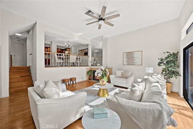 1824 S Marengo Ave Unit 27, Alhambra, CA 91803 - living room featuring stairway, a chandelier, ceiling fan, and wood finished floors