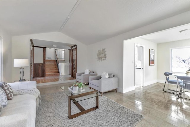 living room with lofted ceiling