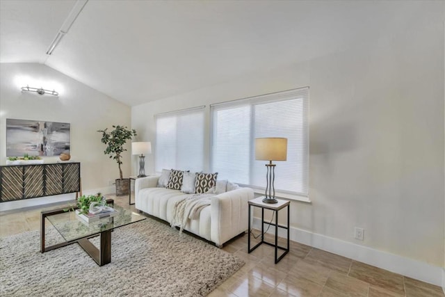 living room featuring vaulted ceiling