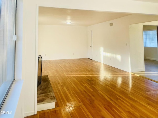 empty room with hardwood / wood-style floors