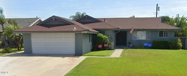 single story home with a garage and a front lawn