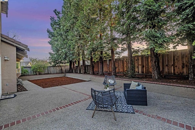 view of patio terrace at dusk