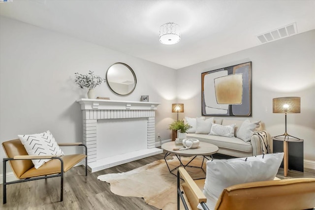 interior space with hardwood / wood-style flooring and a fireplace