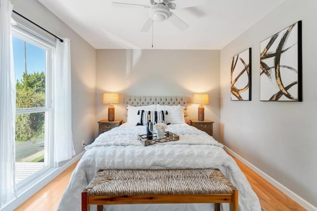 bedroom with ceiling fan and light hardwood / wood-style floors