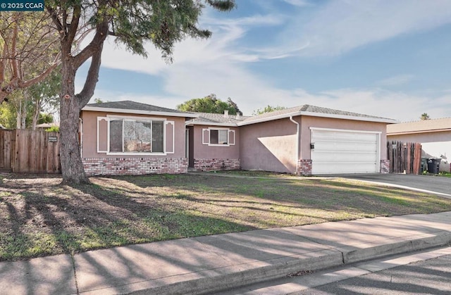 ranch-style home featuring a front lawn and a garage