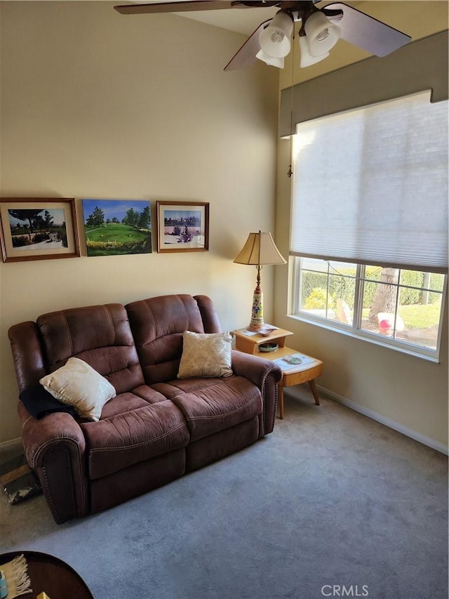 living room with ceiling fan and carpet flooring