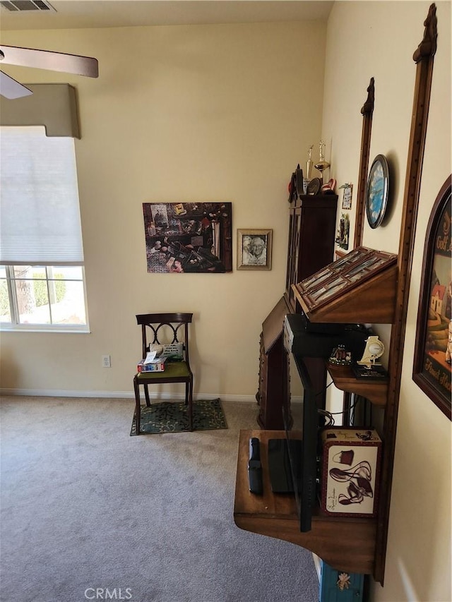 misc room with ceiling fan and carpet flooring