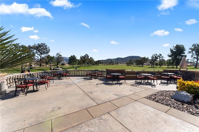 view of patio / terrace featuring a mountain view