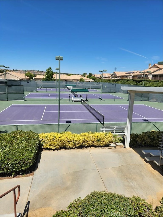 view of sport court with basketball hoop