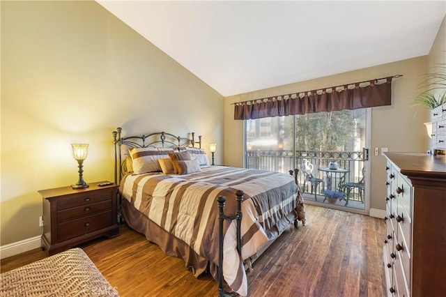 bedroom featuring access to exterior, vaulted ceiling, and dark wood-type flooring