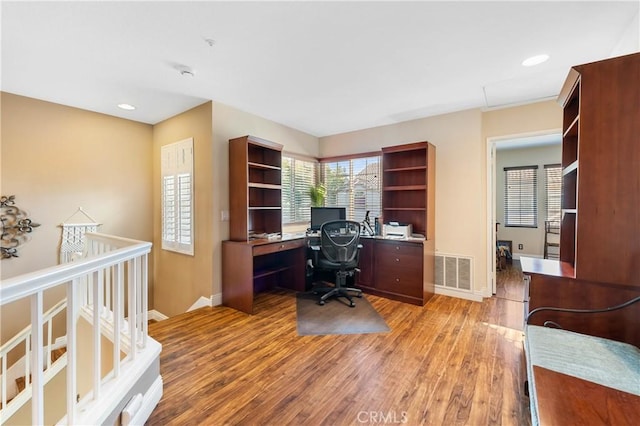 home office featuring light hardwood / wood-style floors