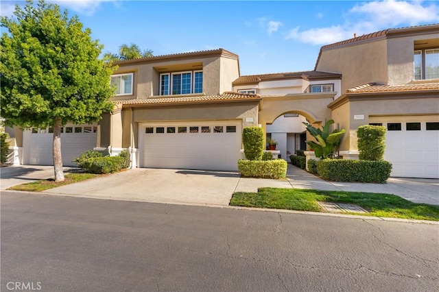 mediterranean / spanish house with a garage