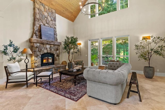 living room featuring a high ceiling, a fireplace, a chandelier, and wood ceiling