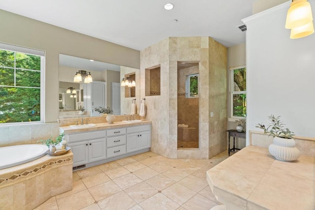 bathroom featuring vanity, tile patterned floors, and independent shower and bath