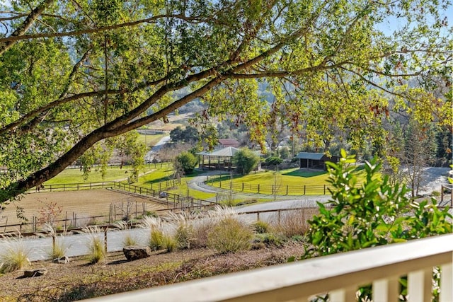 exterior space with a rural view and a yard