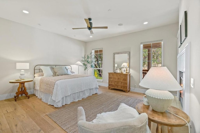 bedroom featuring ceiling fan and light wood-type flooring