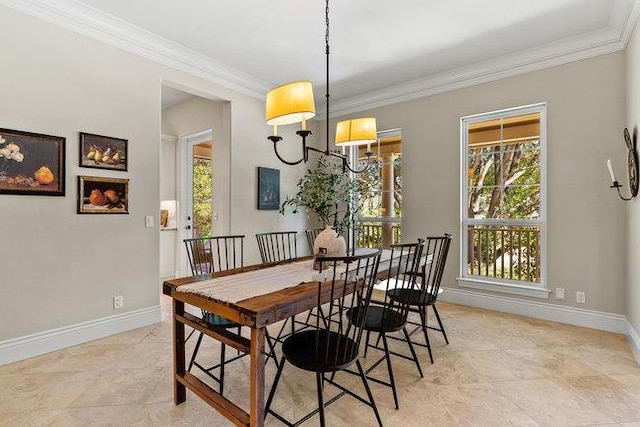 dining area with a notable chandelier and crown molding