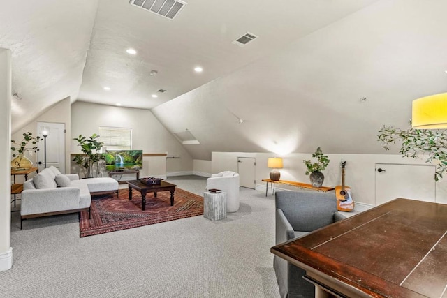 carpeted living room featuring lofted ceiling