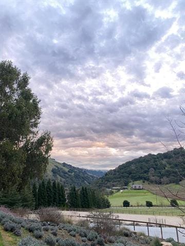 view of mountain feature with a rural view