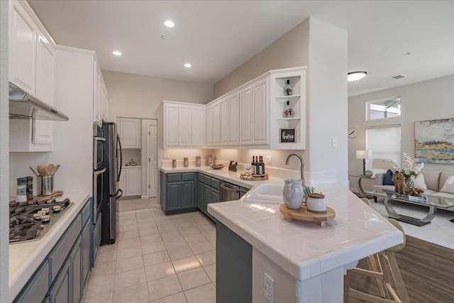 kitchen featuring white cabinetry, appliances with stainless steel finishes, sink, and gray cabinetry