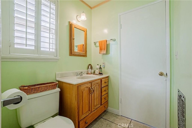 bathroom featuring toilet, vanity, tile patterned floors, and ornamental molding