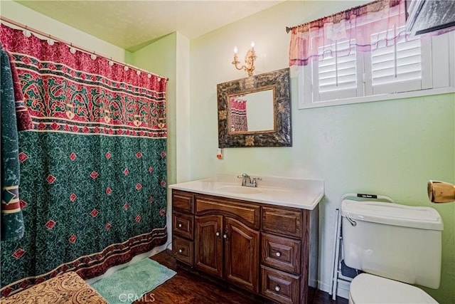 bathroom featuring hardwood / wood-style floors, vanity, and toilet