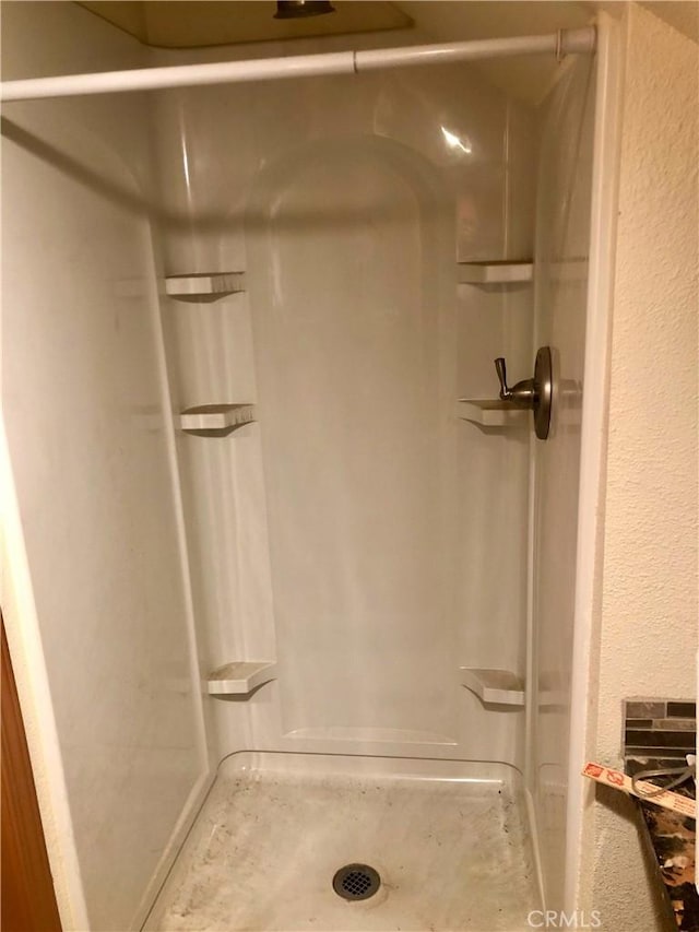full bathroom featuring a stall shower